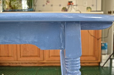 First coat of latex paint on table
