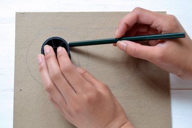Hold the spool in place while you trace.