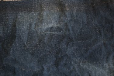 You can create additional distress to the fabric by sanding it.
