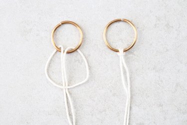 Tie a larkshead knot