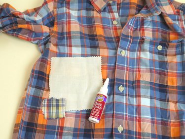 Fabric patches added to the front of the shirt with fabric glue.
