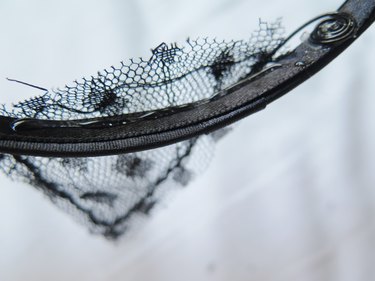 Extra fabric from the cat ears popping out.