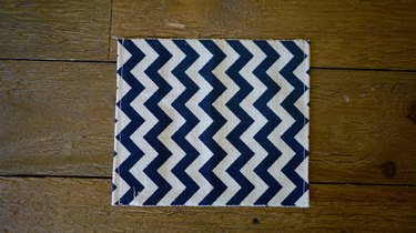Fabric hemmed on two sides.