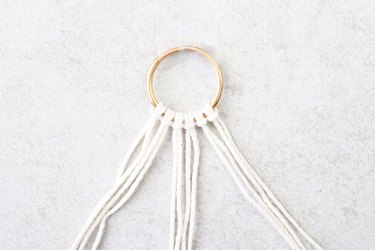 Tie six larkshead knots