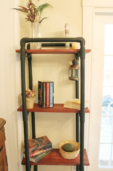 finished bookshelf made from pvc pipe and wood