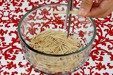 Cut wood toothpicks in half.