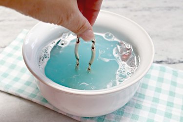 Adding jewelry to bowl for cleaning