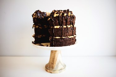 A German chocolate cake displayed on a cake stand.