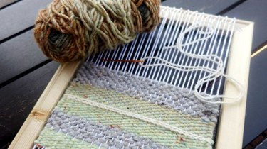 Homemade loom with half-woven design