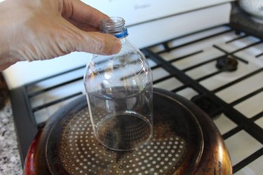 A plastic bottle on hot pan