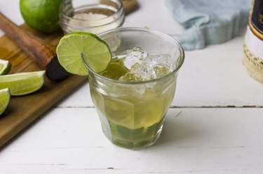 Caipirinha in a glass with lime garnish
