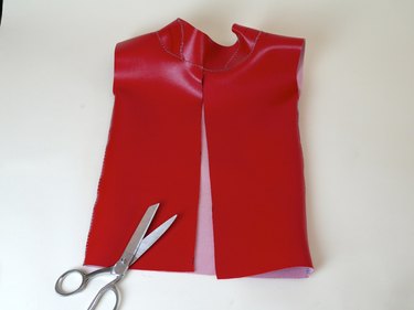 The back of the vinyl top cut from the base to the collar.
