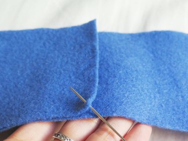 Starting to sew the sides of the DIY felt pencil case