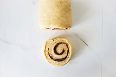 Cutting the roll into individual pieces.
