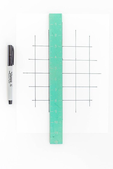 Draw a gridded diagram on a piece of thick white card stock.