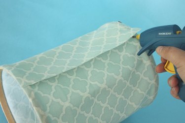 Glue the overlapping fabric.