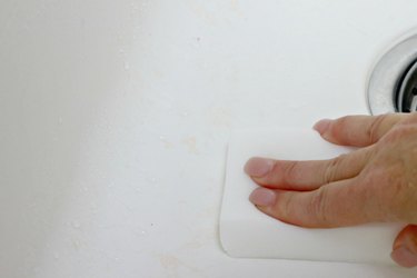Using a Magic Eraser to clean a white kitchen sink