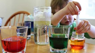 Variety of colors in clear glass containers