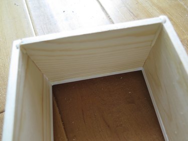 Place between the two long boards and secure into the frame ledge. Wipe away excess glue.