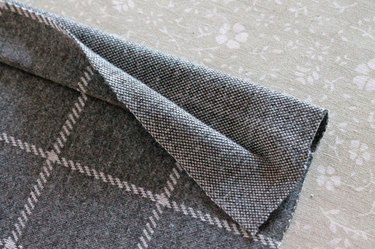 Fold the hem over twice in an accordion fold.