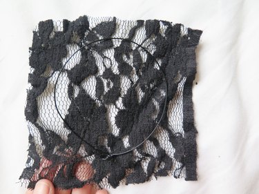 Laying one wire ear flat on top of the lace.