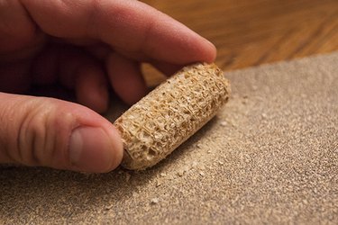 Sand the exterior, top and bottom of the cob.