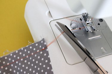 Snip the threads.