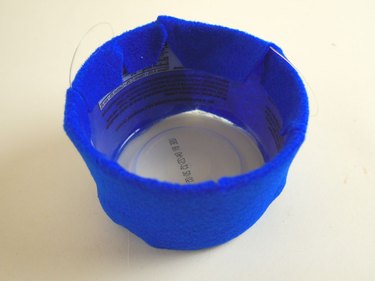 The plastic tub with the sides covered in blue felt.