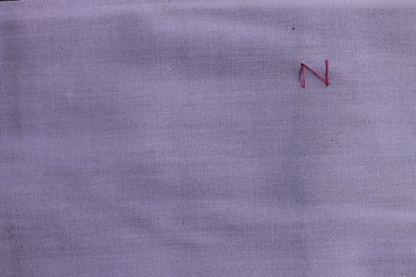 Connecting the threads to make the letter N for zig zag stitch