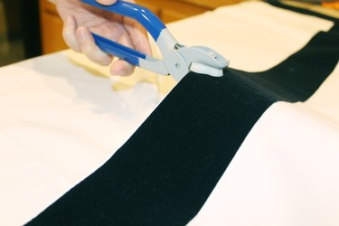 Creating the holes for the grommets.
