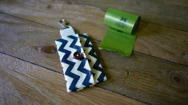 DIY dog waste bag dispenser and dog waste bag roll.