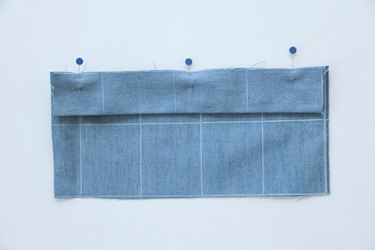 Pin and sew binding to top edge of pocket