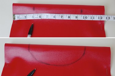 Draw a semicircle for the neck hole.
