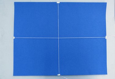 Cross the rope in the center.