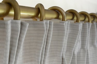 Hang on curtain rod.