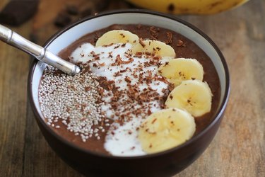 Acai bowl with sliced banana and chia seeds on top.