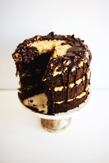 German chocolate cake with a generous slice removed.