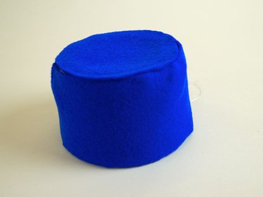 The tub covered in blue felt.