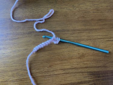 Crochet hook inserted into the chain