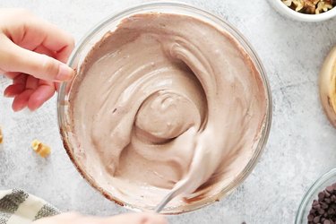 Mix yogurt with cocoa powder