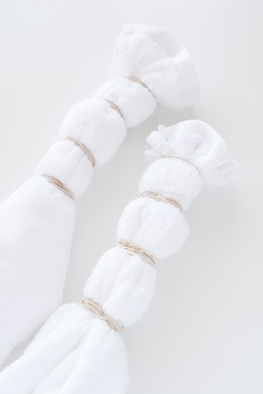 Wrap the towel in elastic bands.