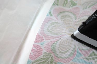 press iron-on adhesive to fabric back