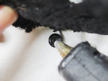 Adding hot glue to the wire coil