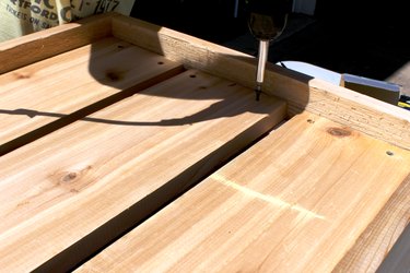 drill the 34 1/4" wood planks to create box bottom | how to make an elevated planter box