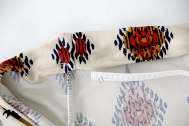 Insert elastic into waistband casing