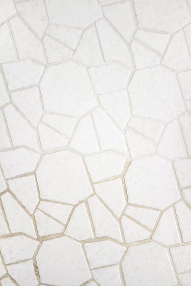 half painted grout and half unpainted grout