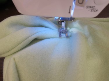 Pleat and sew ears to hood