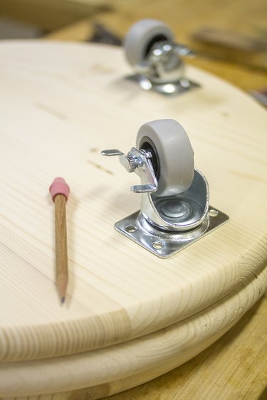 Mark holes through the placed and measured casters.