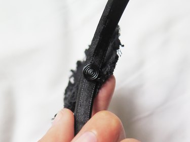 The coil hot glued to the headband