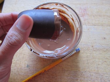 Submerge edge in chocolate